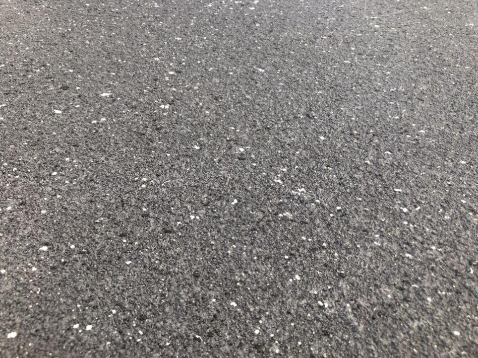 Concrete resurfacing in French Grey with salt-and-pepper flecks mimicking exposed aggregate
