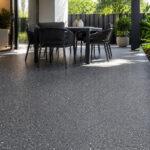 Resurfaced concrete patio on a Gold Coast home with a flecked Step Safe Heavy Duty finish, applied over the existing slab