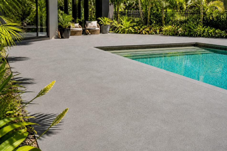Light-tinted spraycrete pool surround on a Gold Coast residential property