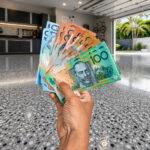 hand holding money representing epoxy flooring costs on Gold Coast