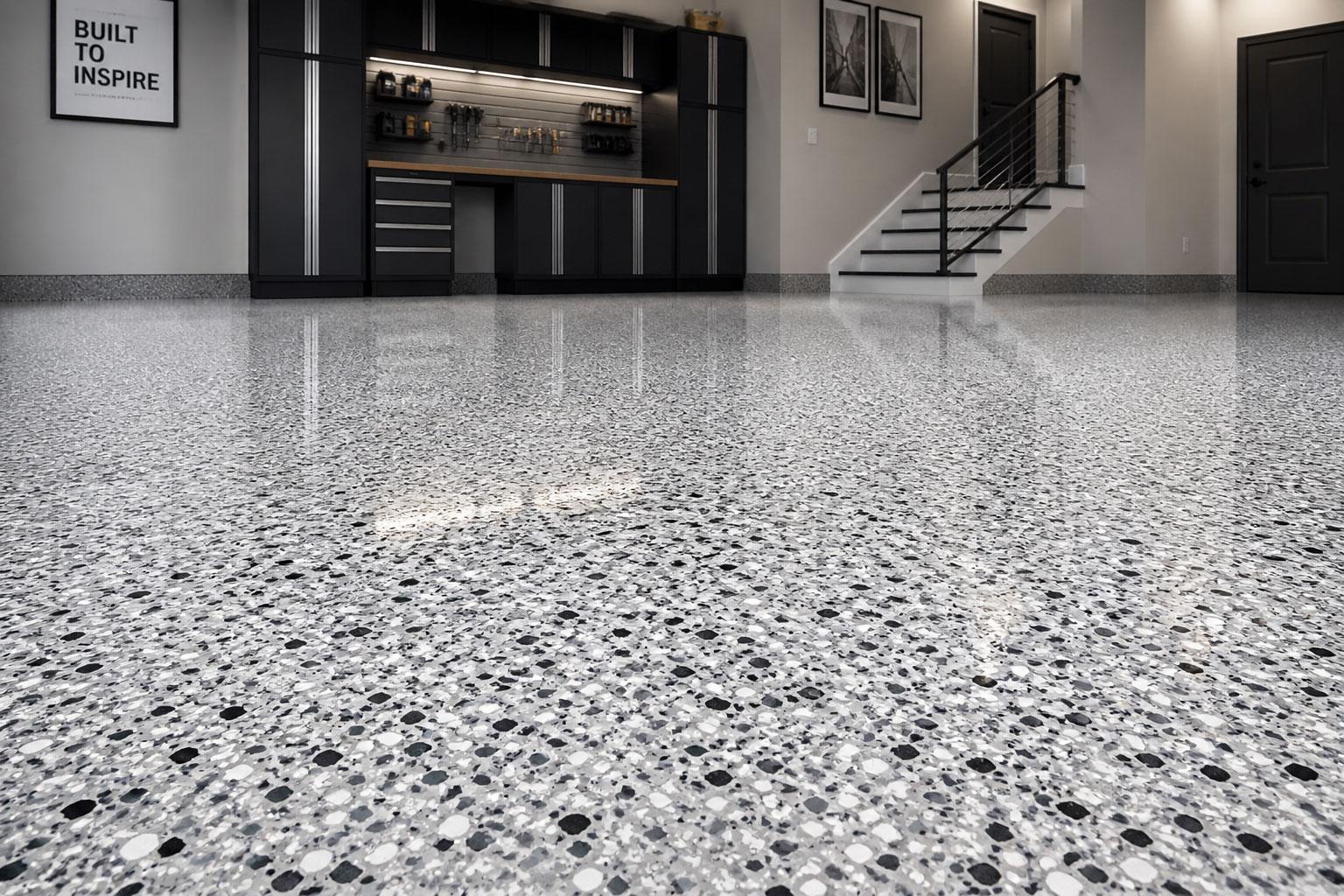 Professional epoxy garage floor on a Gold Coast home with a Colour Flake® decorative finish over a diamond-ground basecoat, sealed with a non-yellowing polyurethane topcoat