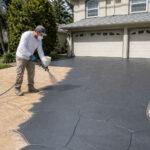 Resurfaced stamped concrete driveway on a Gold Coast home, refreshed with a covercrete overlay
