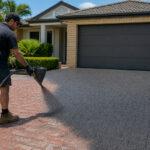 Resurfaced stencilled concrete driveway on a Gold Coast home, refreshed with the Dulux Avista system over the original stencil pattern